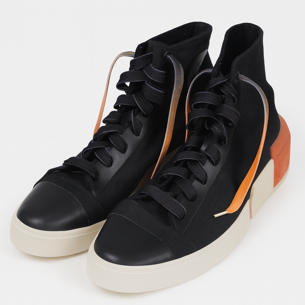 Black high tops worn with  Gradient Shoelaces that go from deep black to vibrant orange shown in a white background 